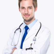 Smiling male doctor in white coat.