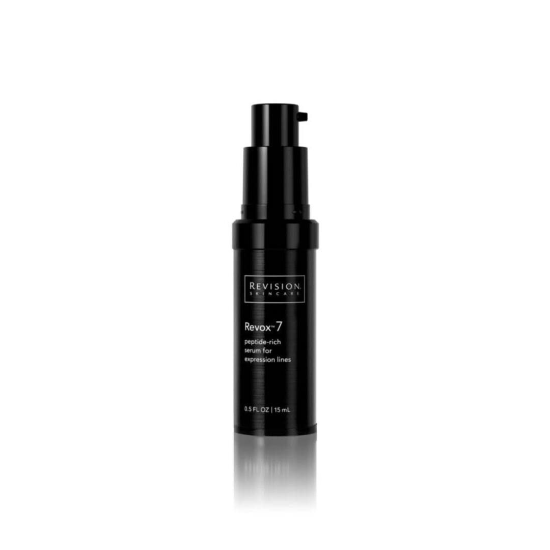 A bottle of Revox 7 anti-aging serum on a white background.