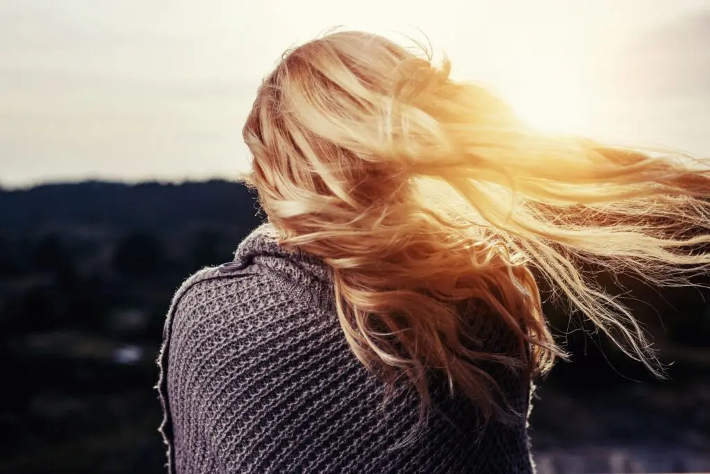 Woman with long hair in the wind.