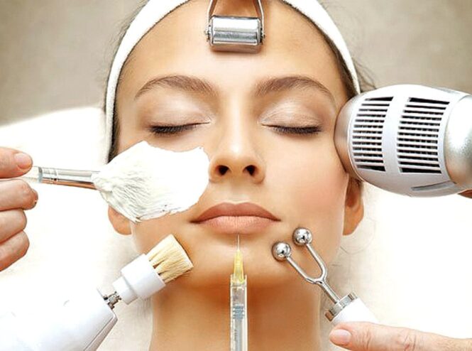 Woman receiving facial treatments with tools.